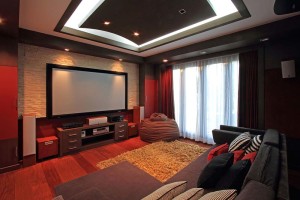 Theater room in luxury home with wide screen